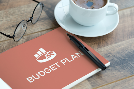 budget planning book on table budget planning book on table